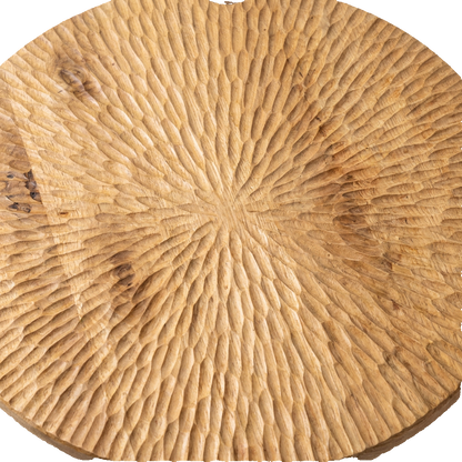 Round solid wood coffee table, carved tabletop texture close-up