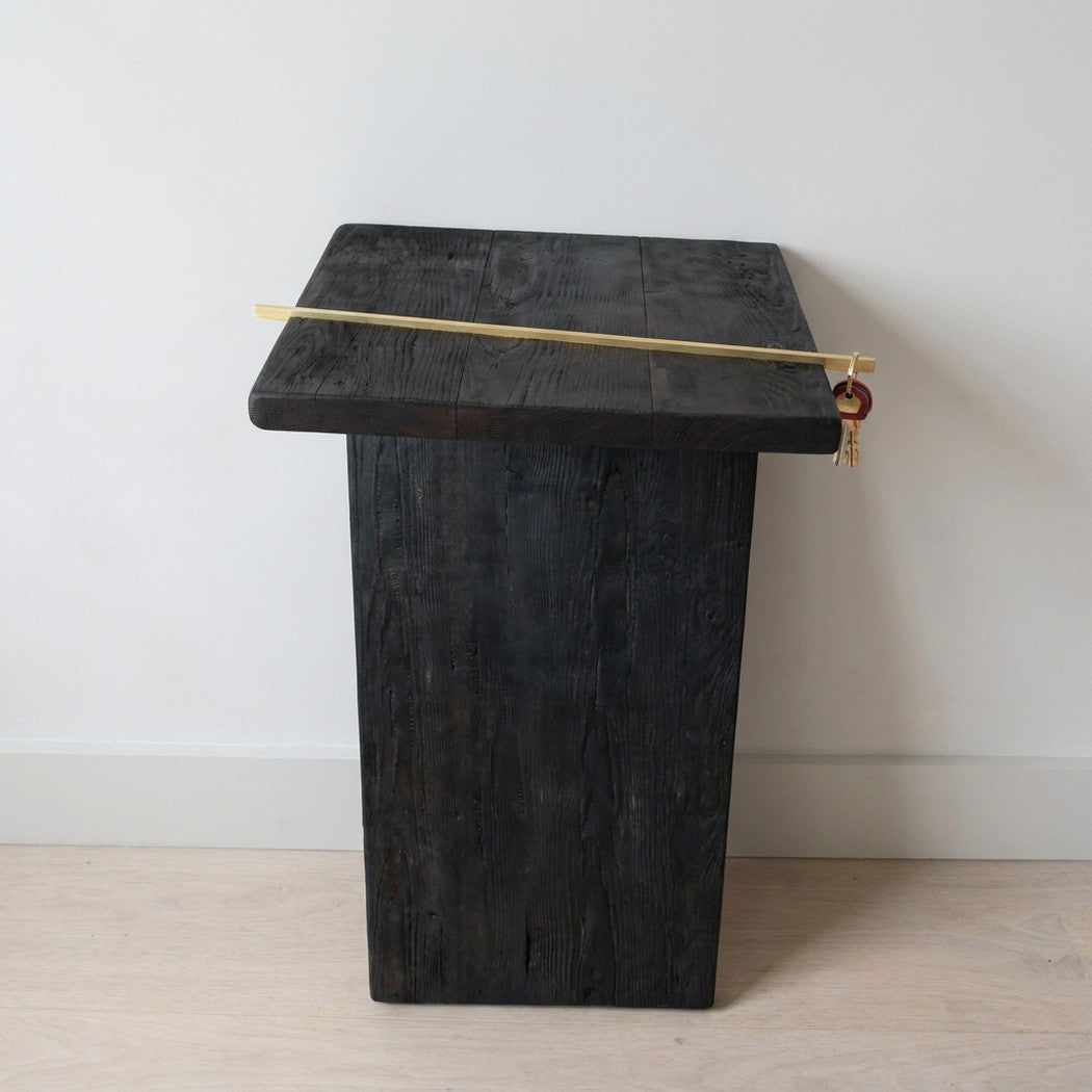 7 console table seen from the front in a pale entryway, keys on the rod