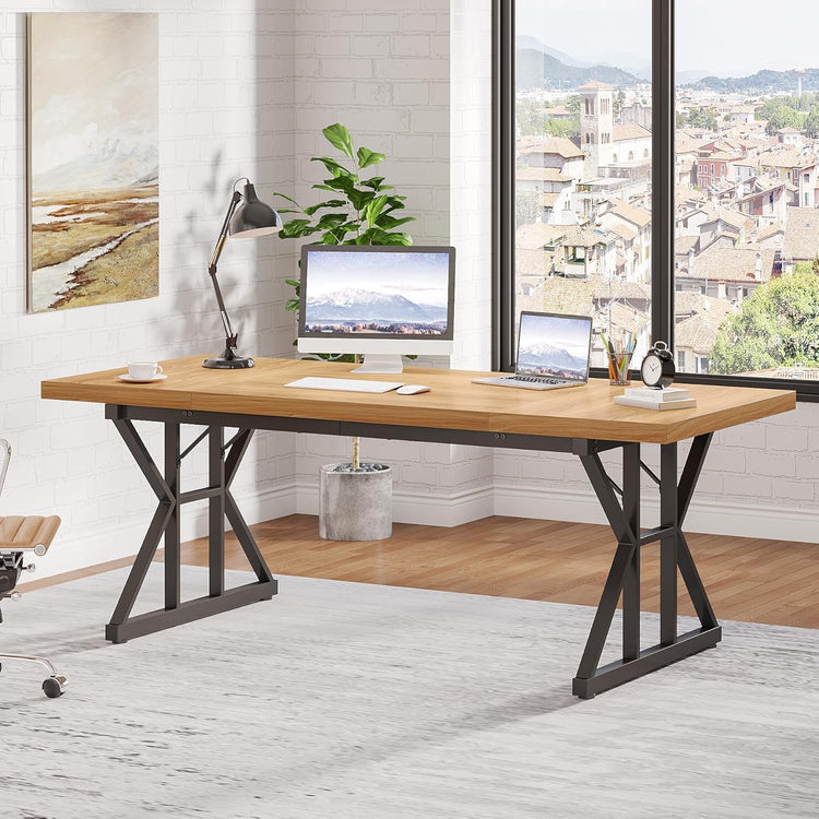 70.8-inch wooden executive desk with black metal X-frame legs in a bright home office, featuring a desktop computer and laptop.