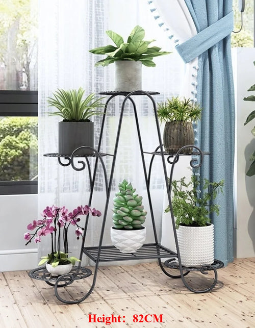 Black 6-layer metal plant rack for flowers and pots, space-saving vertical garden display.