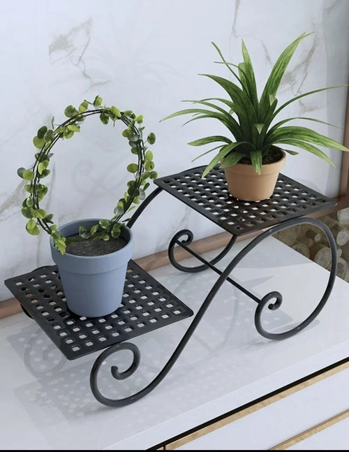 Black 6-layer metal plant rack with curved legs, space-saving flower pot display.