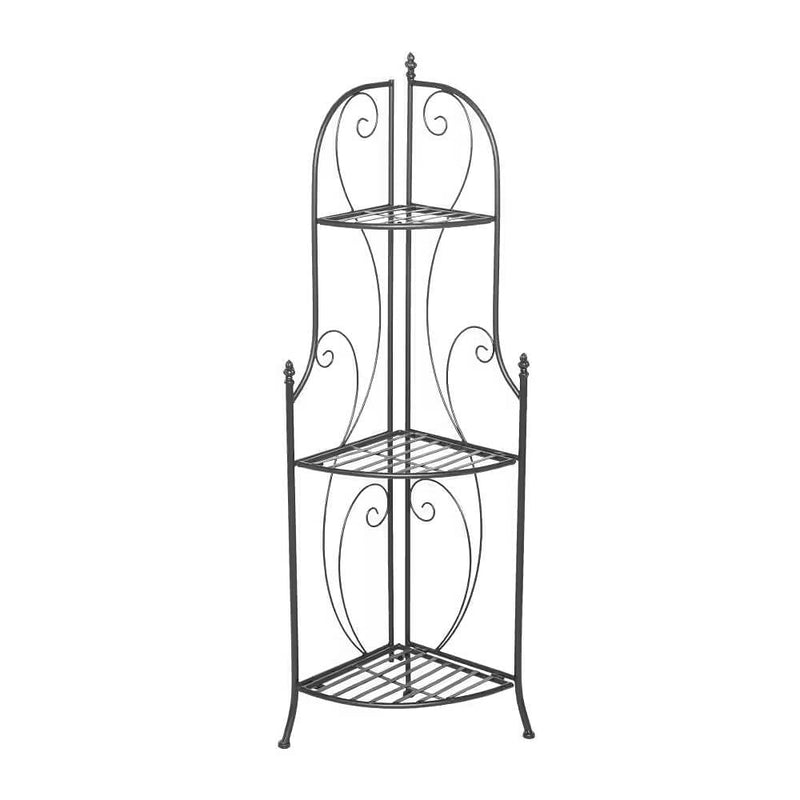 Black metal corner shelf with decorative scrollwork on a white background