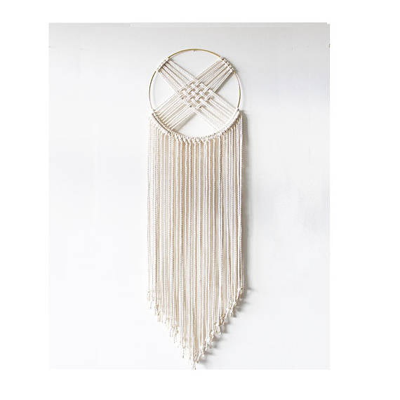 Bohemian macrame dreamcatcher wall hanging with gilded brass hoop and long fringe