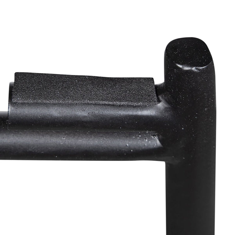 Close-up of a black metal handle on a white background