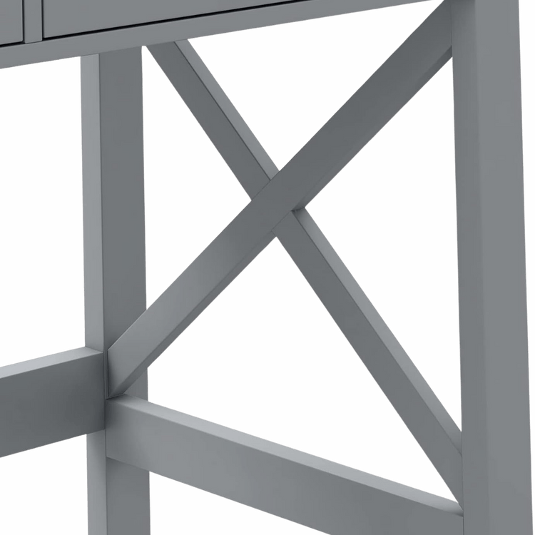 Close-up of a grey home office desk leg with an X-frame cross brace.