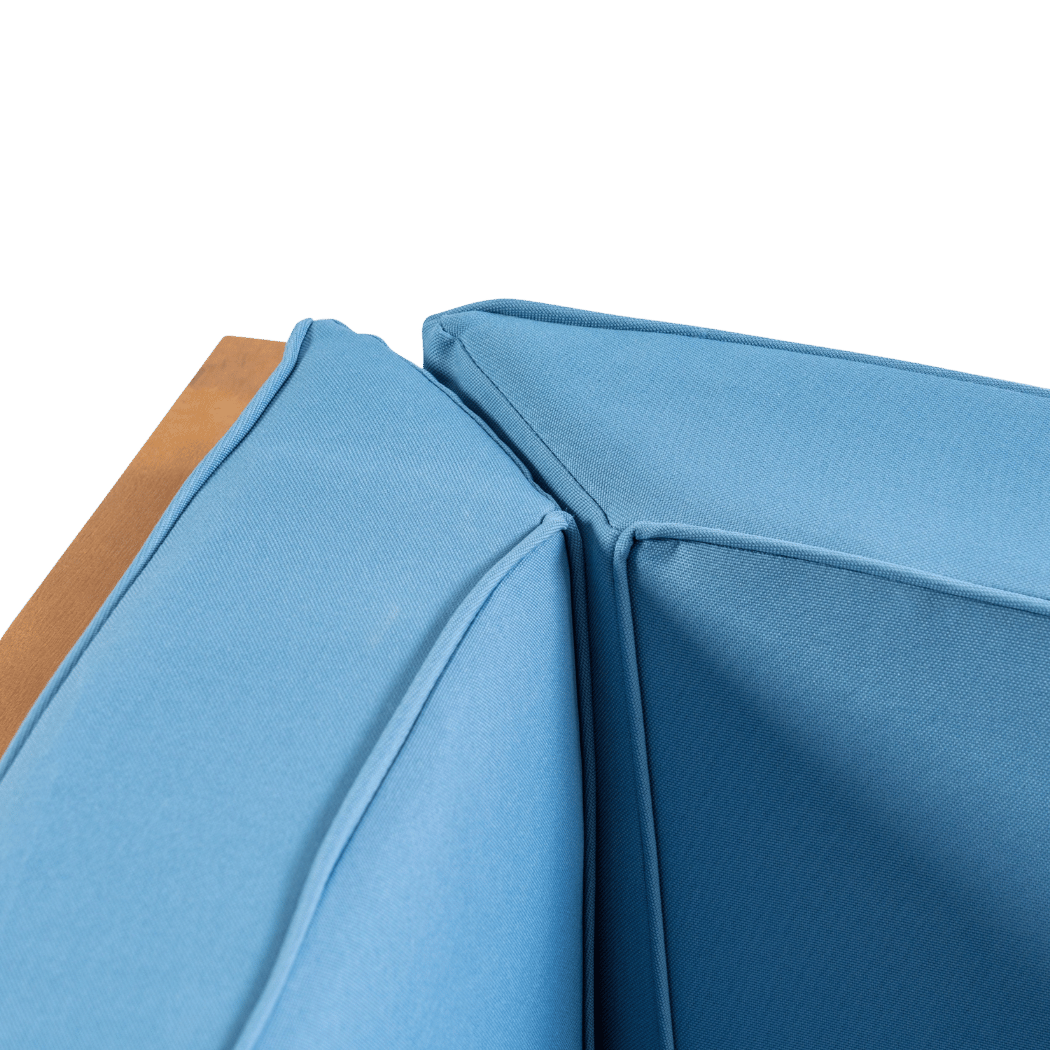 Close-up of the blue cushion covers and piping at the corner seat (close-up detail)