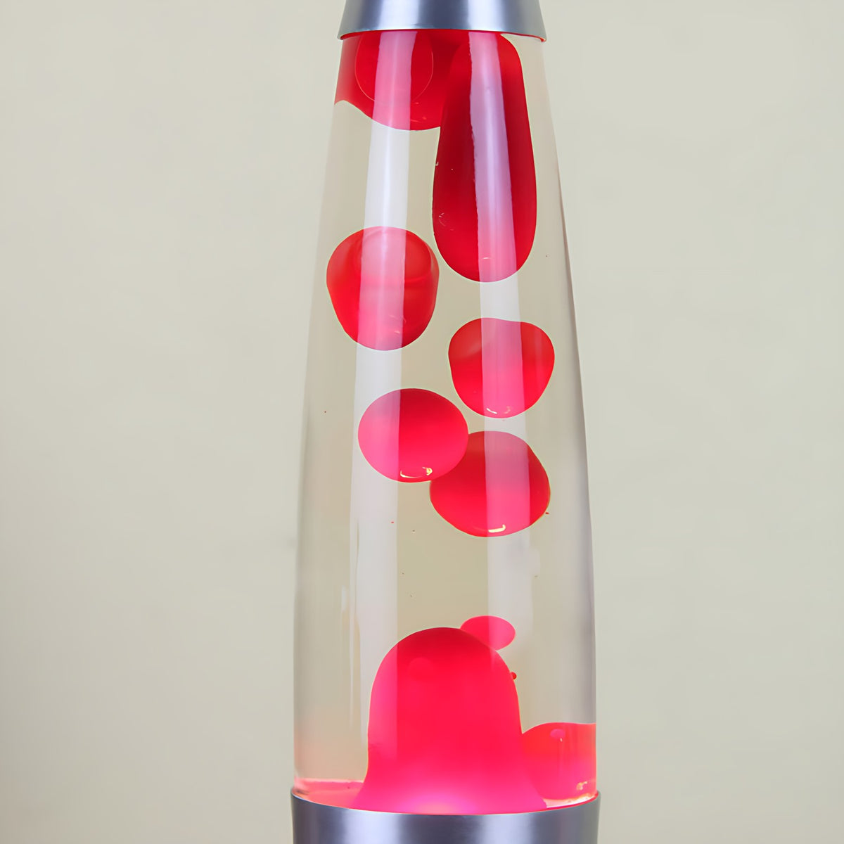 Colorful Wax Motion Lamp and clear sections on a beige background