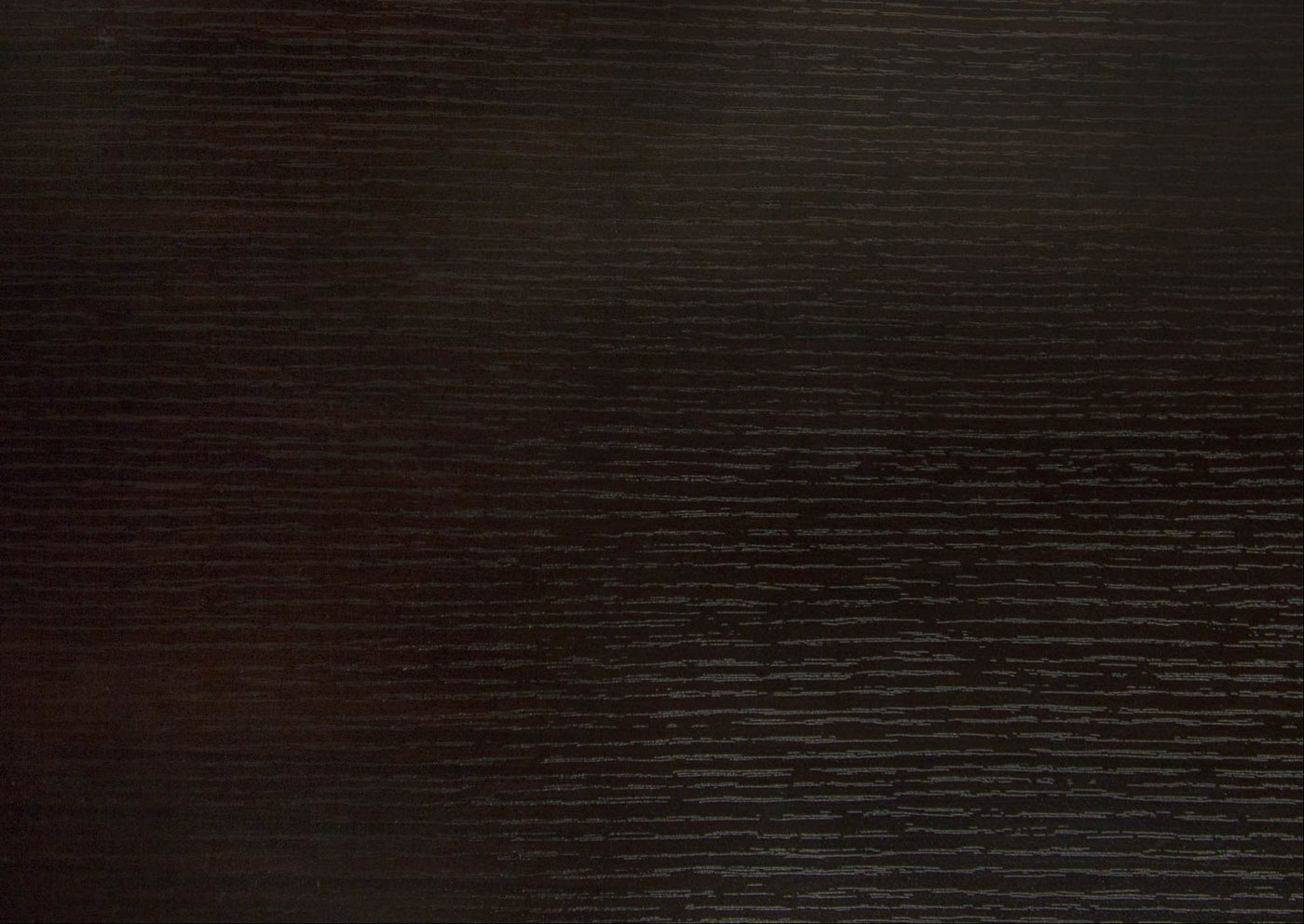 Dark brown wood grain desk surface.