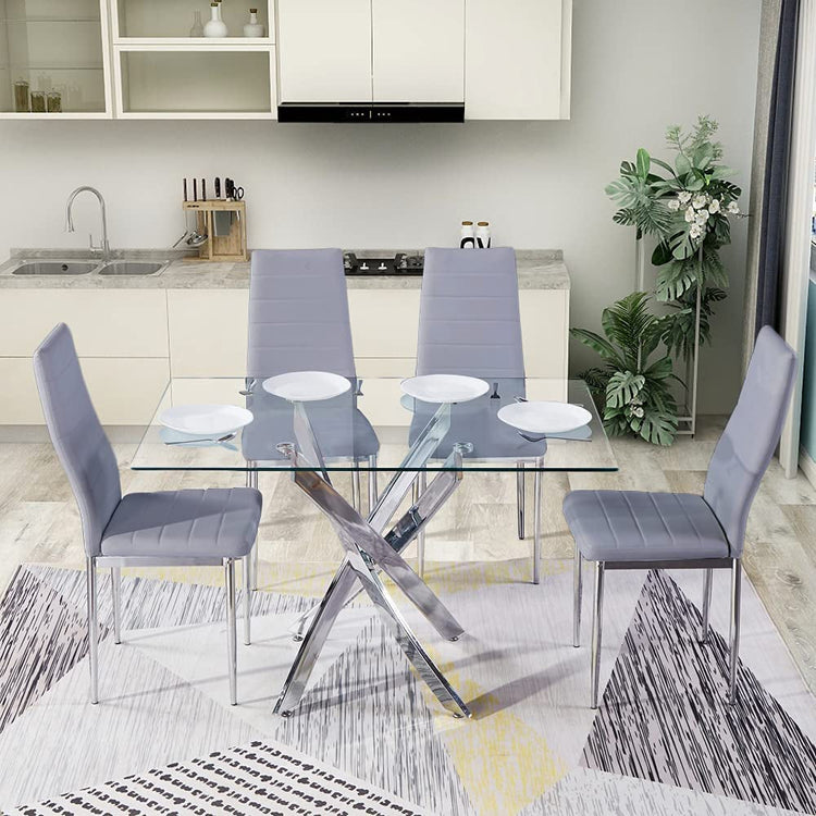 Dining area with glass table and gray chairs in a modern kitchen.
