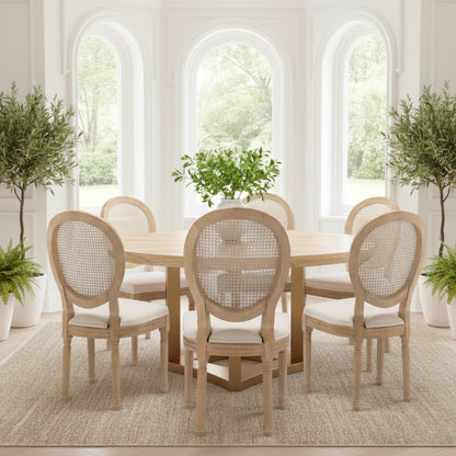 Dining room with wooden table and chairs in a bright, sunlit room.