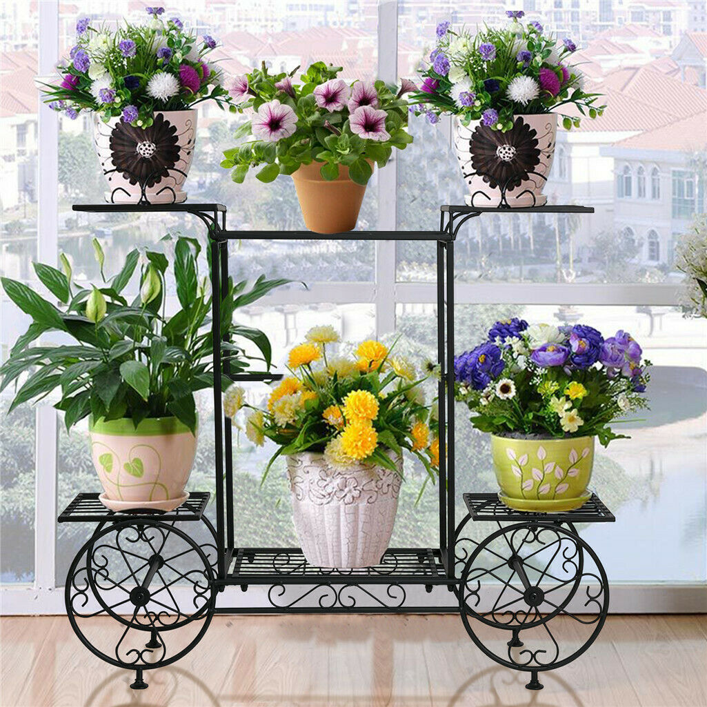 Durable six-tier wrought-iron garden cart plant holder with colorful potted flowers.