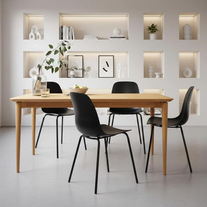 Elegant Luxury Dining Room Chairs in matte black, set of 4 around a wooden dining table in a modern kitchen-living room