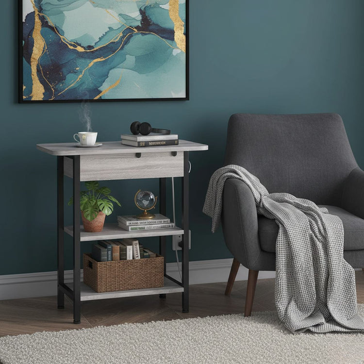 End table with left-side vertical charging station, two USB ports, and two 120V outlets beside a gray chair.
