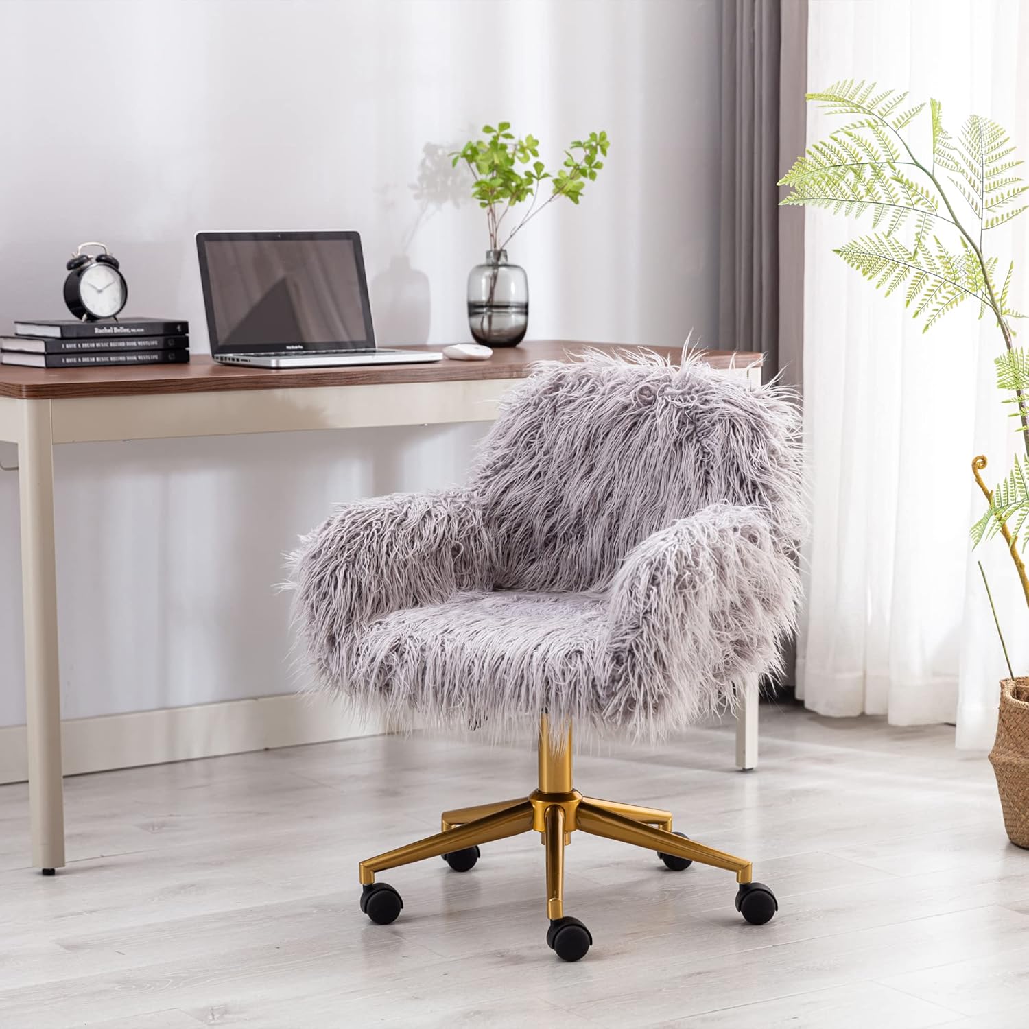 Grey faux-fur chair with chrome base and adjustable height in a modern home office.