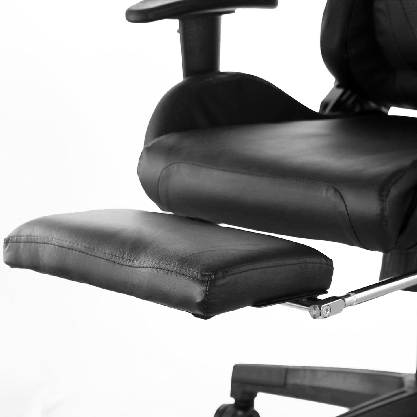 GameFitz black gaming chair with folding foot rest, padded head pillow, and lumbar support.