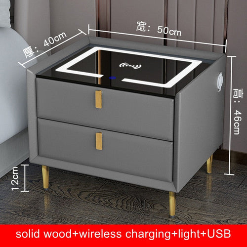 Gray bedside table with two drawers, Qi wireless charging pad, USB ports, and ambient night light.
