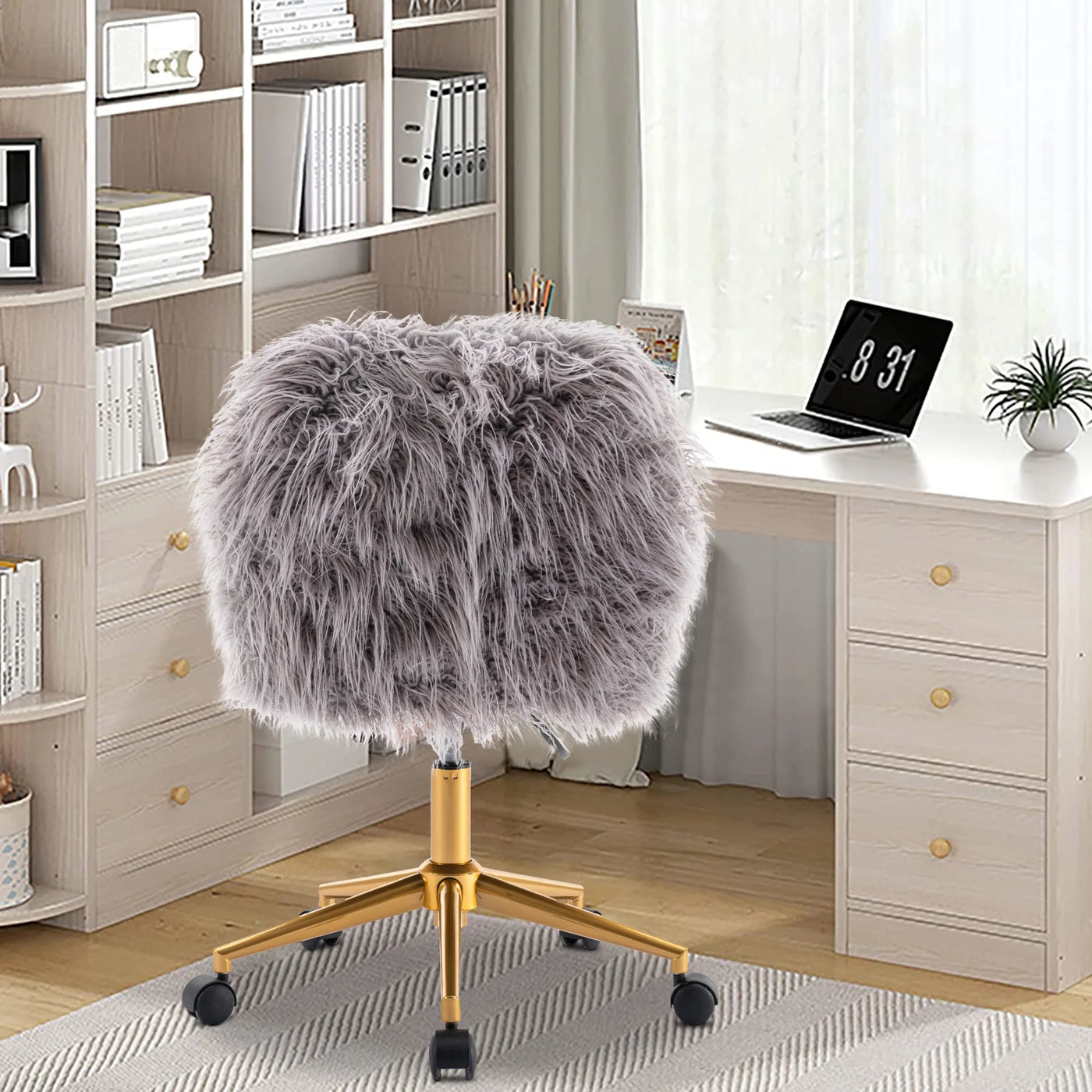Grey faux fur chair with chrome base and adjustable height in a bright home office