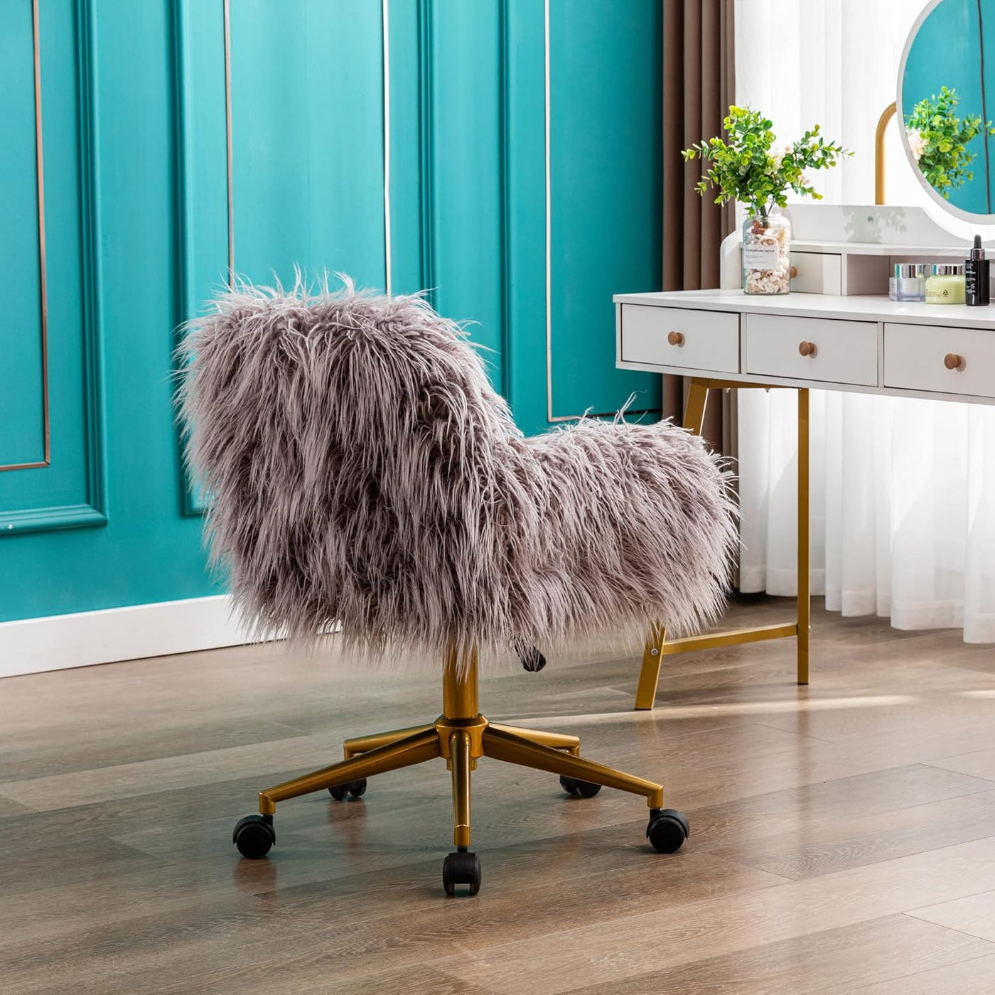 Grey faux fur chair with chrome base and adjustable height in a modern workspace.
