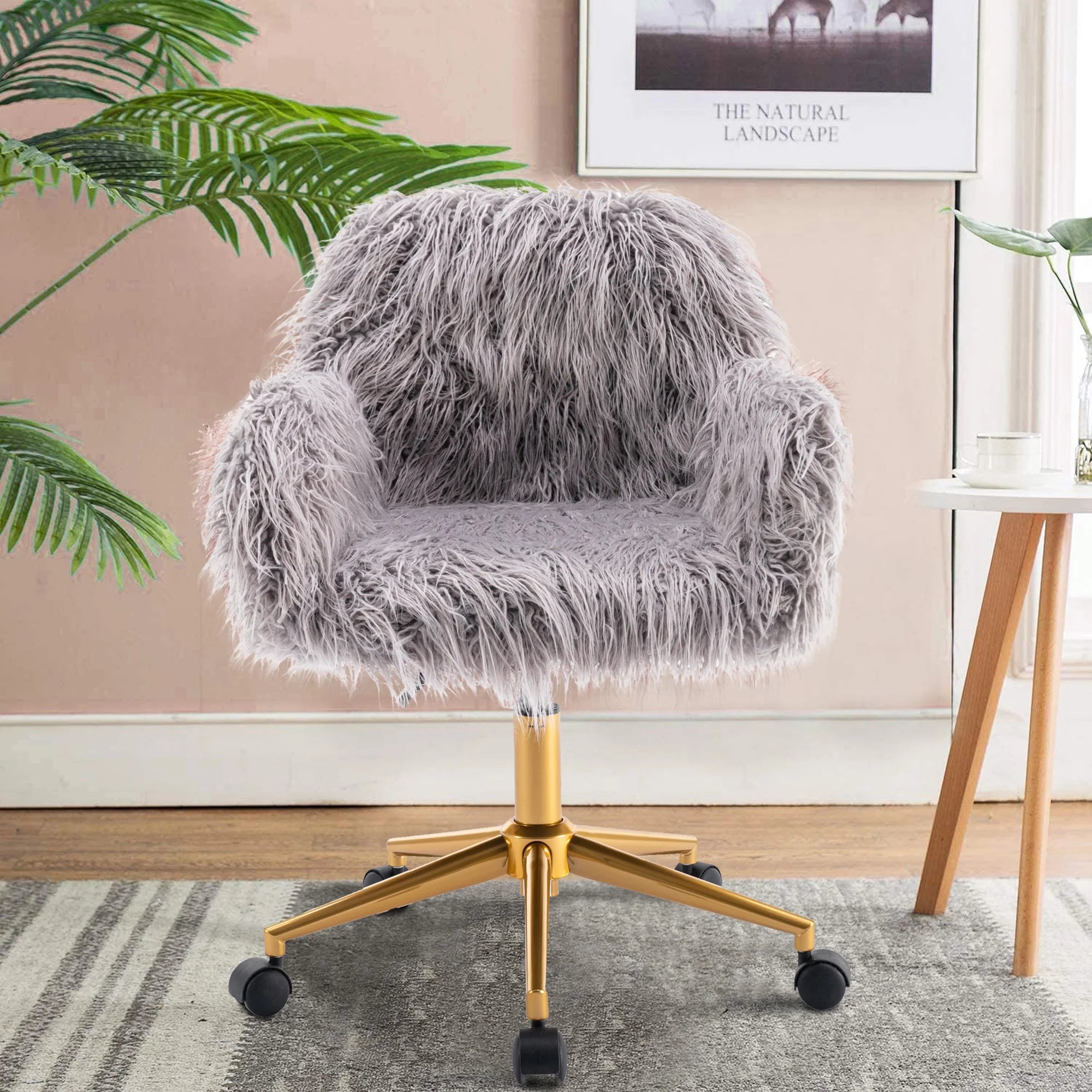 Close-up of grey faux fur chair upholstery with chrome base and adjustable-height design.