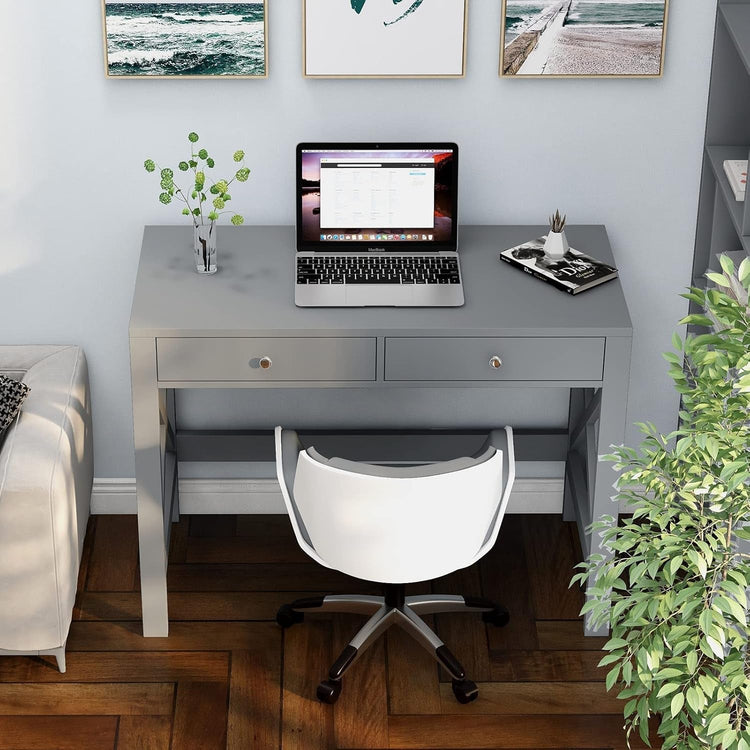 Grey home office desk with two drawers, sturdy computer table, laptop on top.
