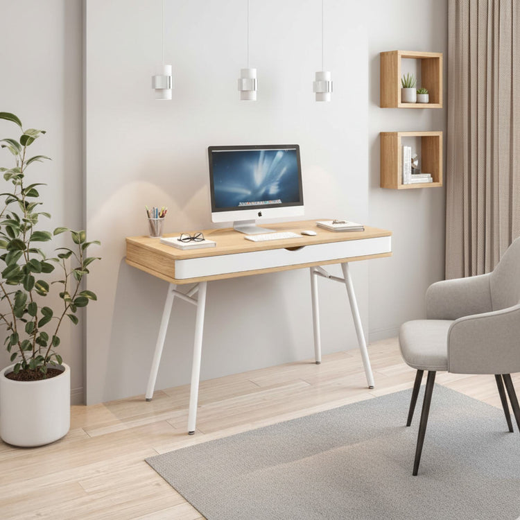Laptop computer desk in pine wood finish with storage drawer and white legs in a modern home office