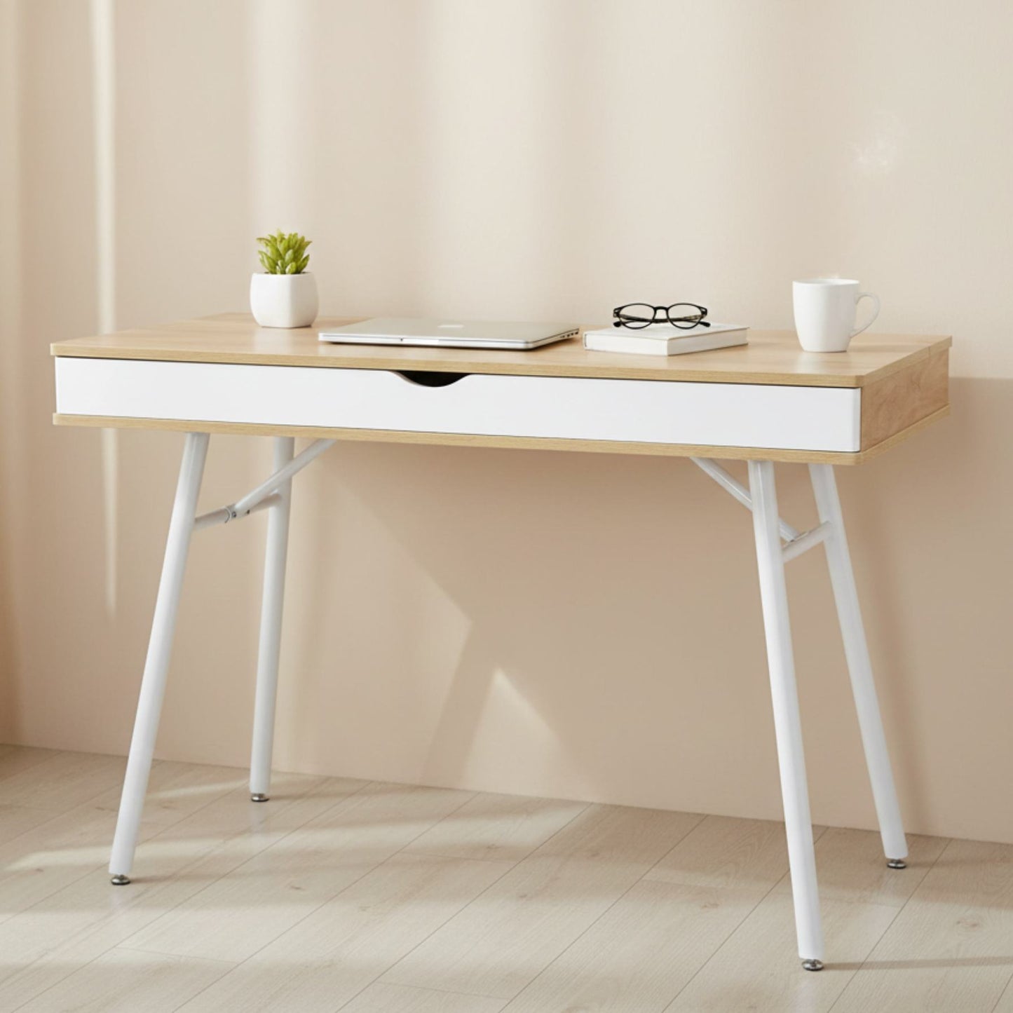 Laptop computer desk with storage drawer in pine wood finish and white steel legs.