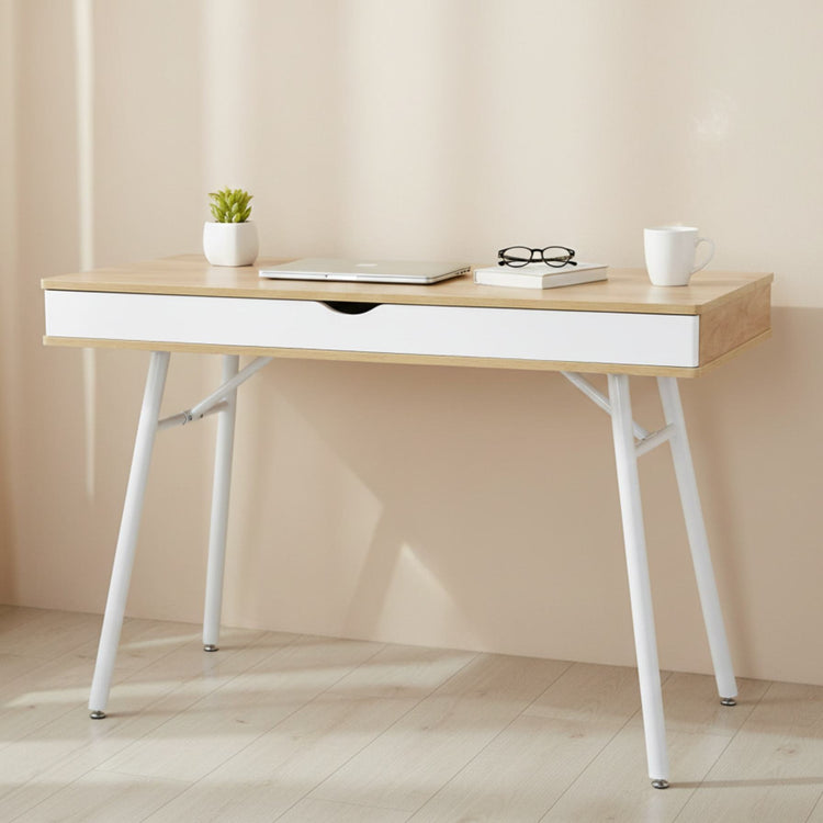 Laptop computer desk with storage drawer in pine wood finish and white steel legs.