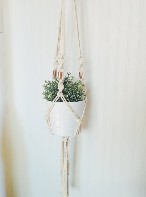 Macrame Plant Hanger Locally Sourced Ontario Cotton Rope, holding a white pot with greenery.