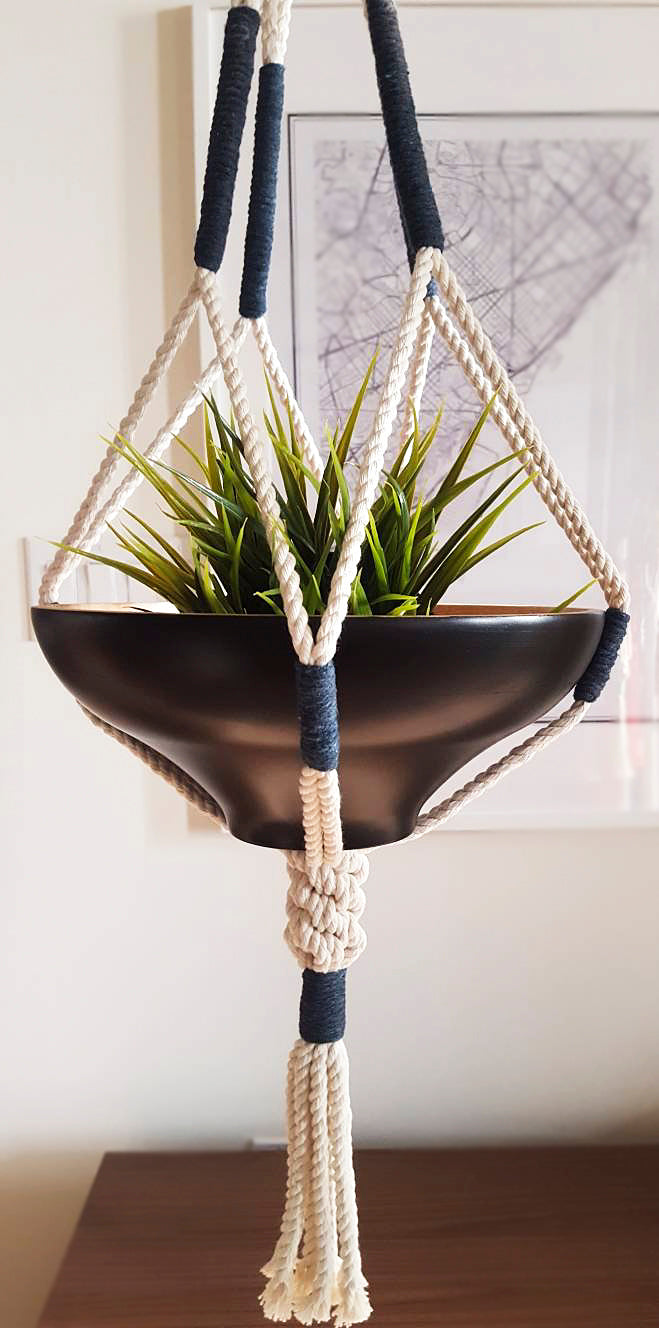 Macrame Plant Hanger Ontario Cotton Rope Handcrafted with navy wraps suspending a green plant in a black bowl