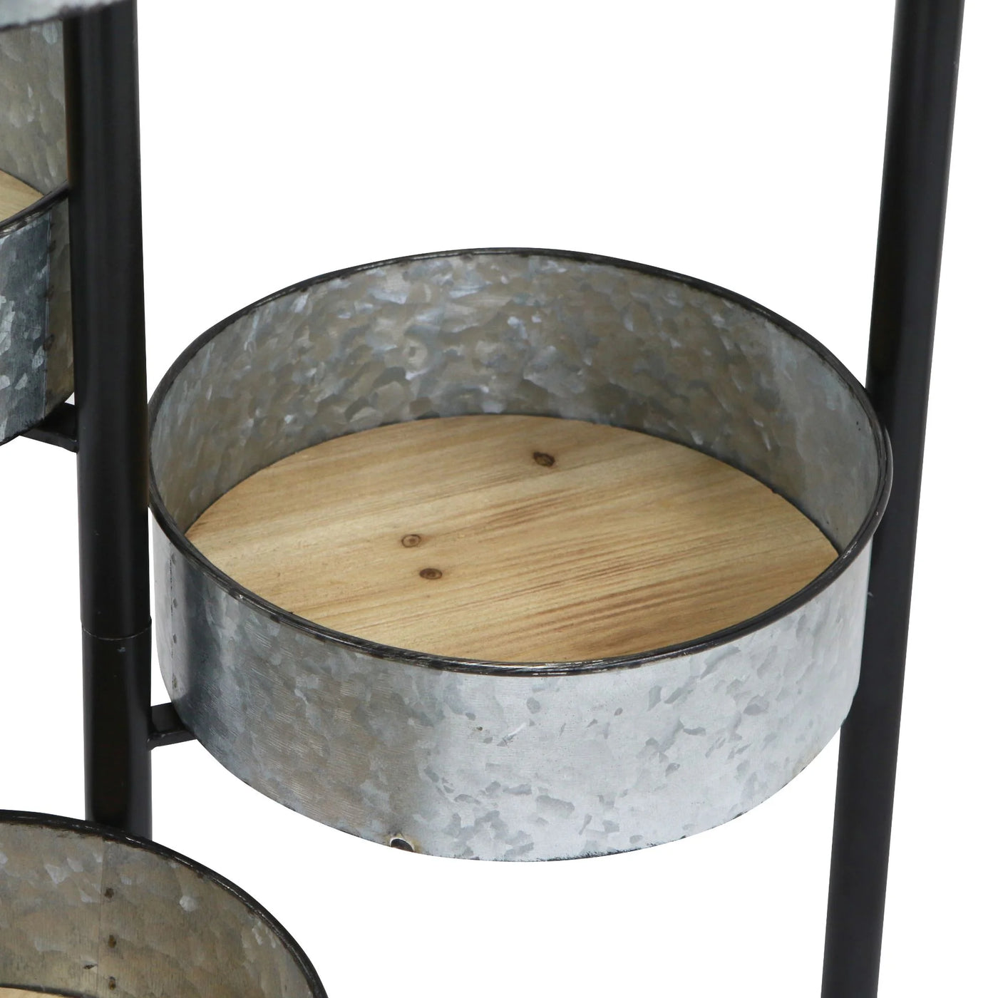 Metal planter with wooden base on a white background