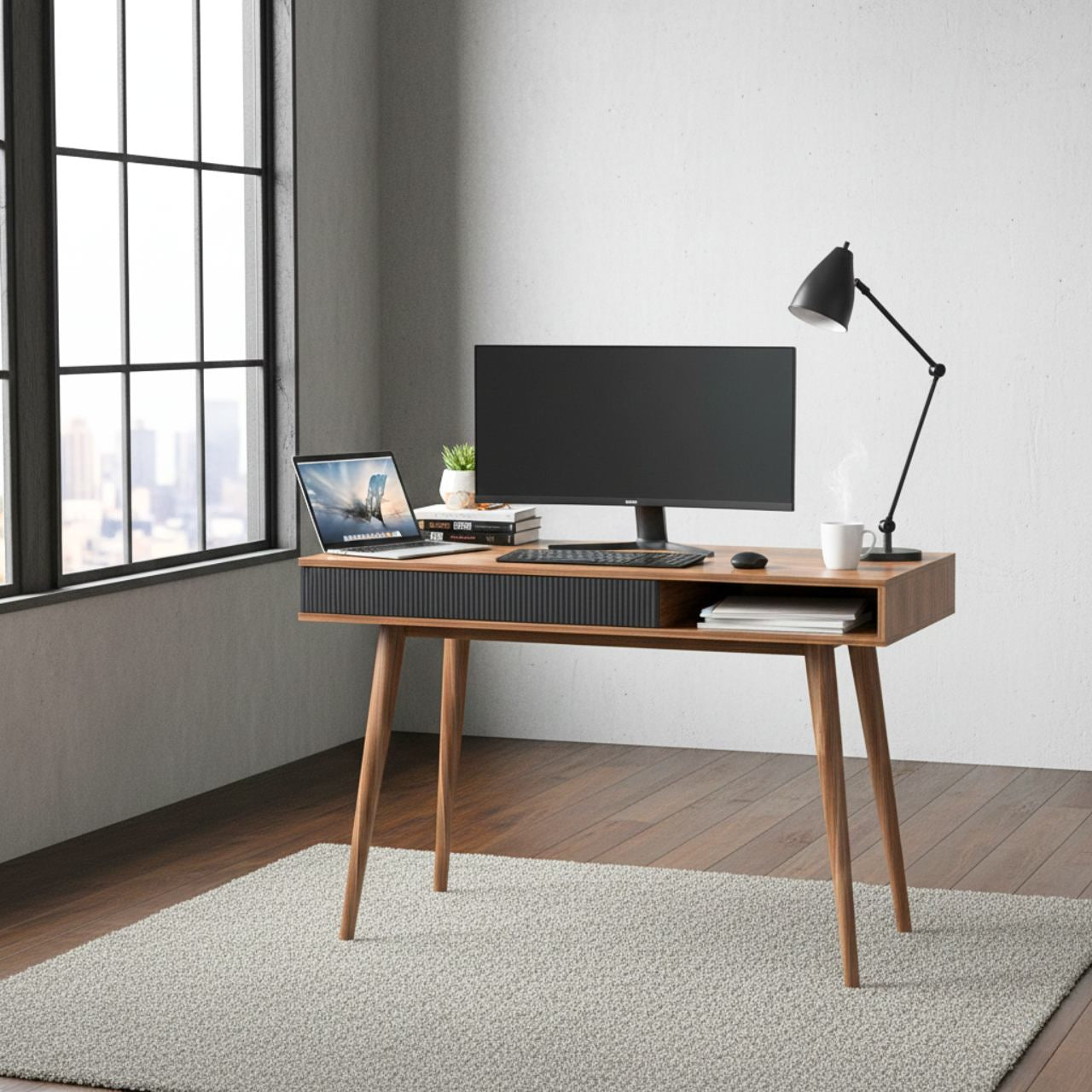 Mid Century Walnut Desk with drawer and 42.5-inch surface in a modern home office, with monitor, laptop, and lamp.