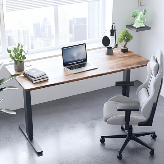 Modern Adjustable office desk with laptop, chair, and decor in a bright room.