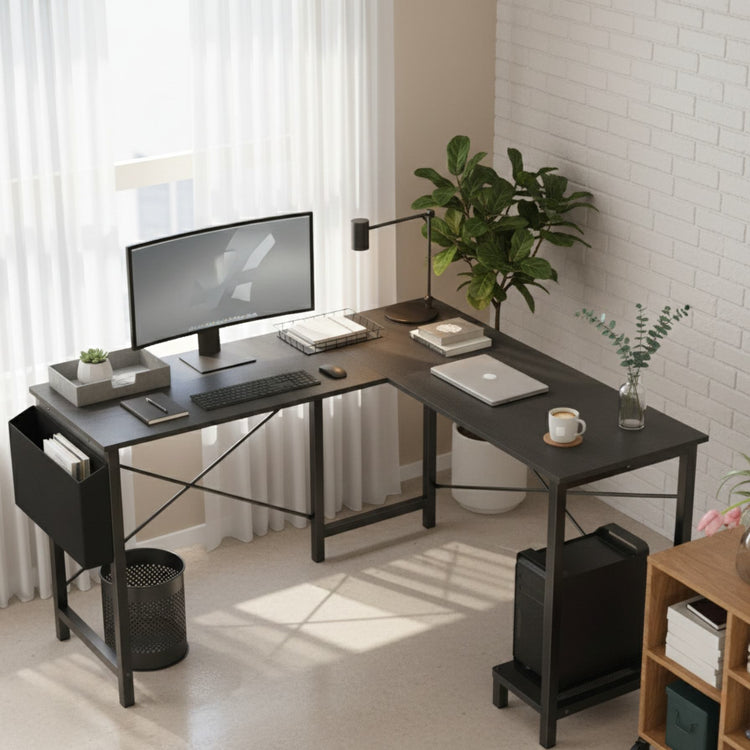 Modern BLACK L-shaped desk setup with computer equipment in a home office.
