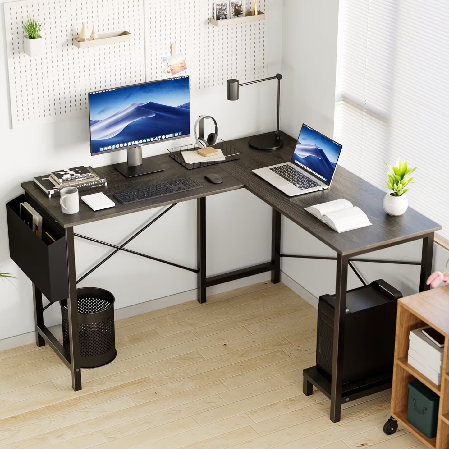 Modern GREY home office with a L-shaped desk, computer setup, and decor.