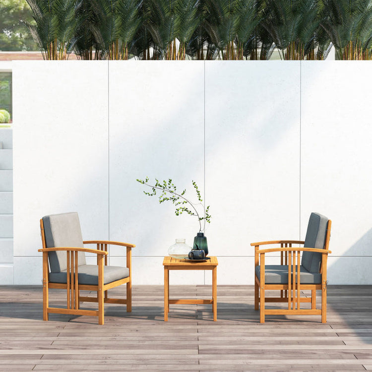 Outdoor furniture set with two chairs and a small table on a wooden deck.