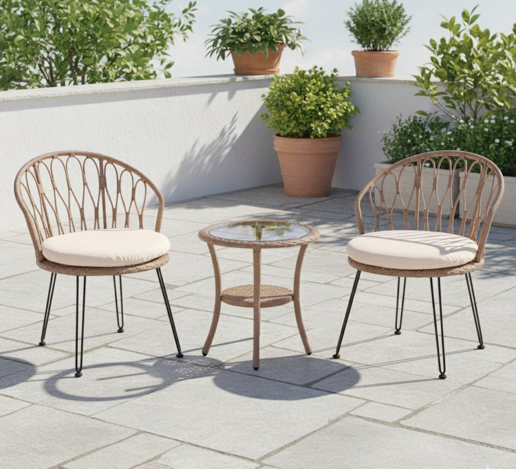 Outdoor patio set with two chairs and a table on a stone patio, surrounded by potted plants.