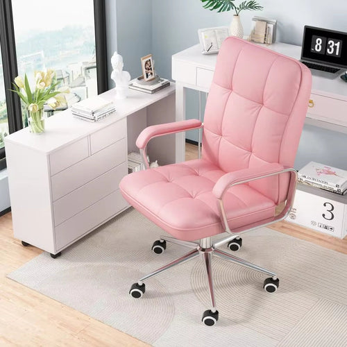 Pink leather swivel ergonomic office chair with tufted back, chrome arms, five-star base in a home office.