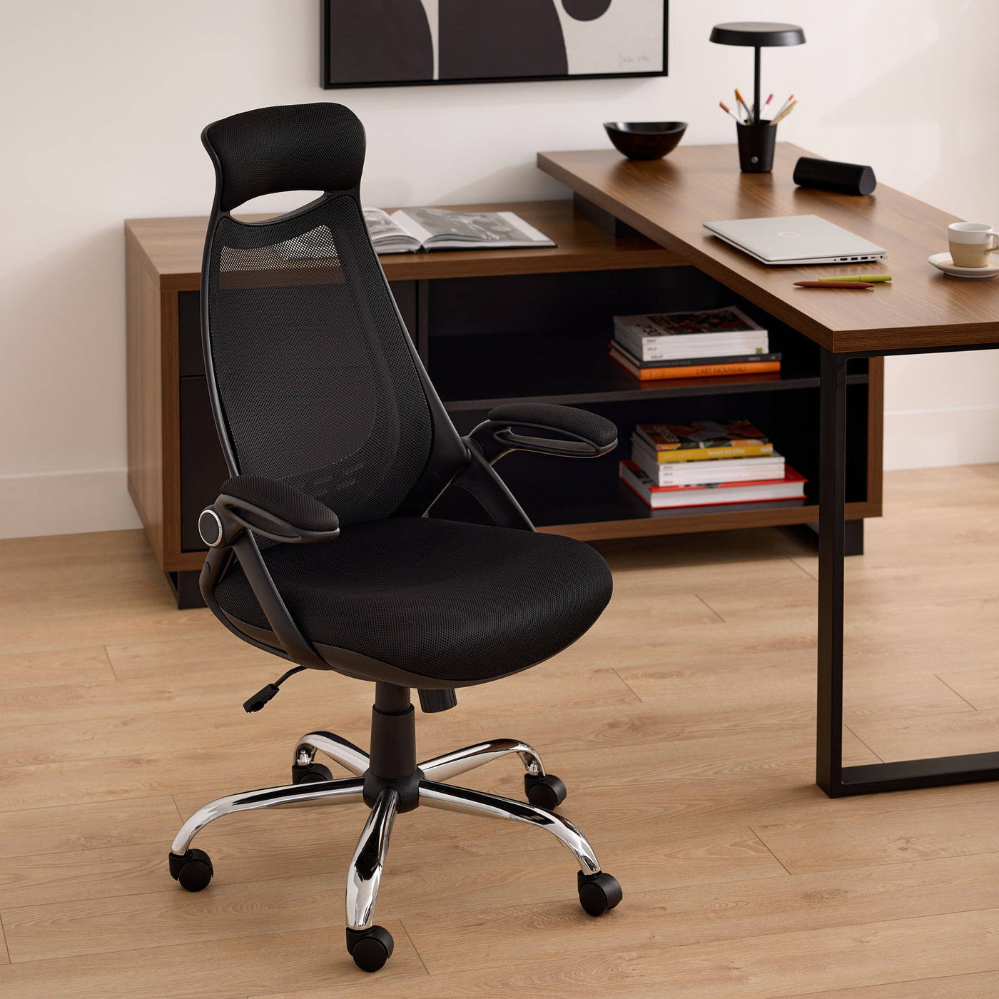 Premium black foam office chair with breathable mesh back, ergonomic and height-adjustable, on a chrome base.