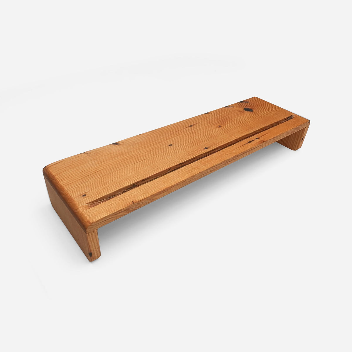 Rustic desk shelf in natural tung-oiled reclaimed wood, three-quarter view on a light studio ground