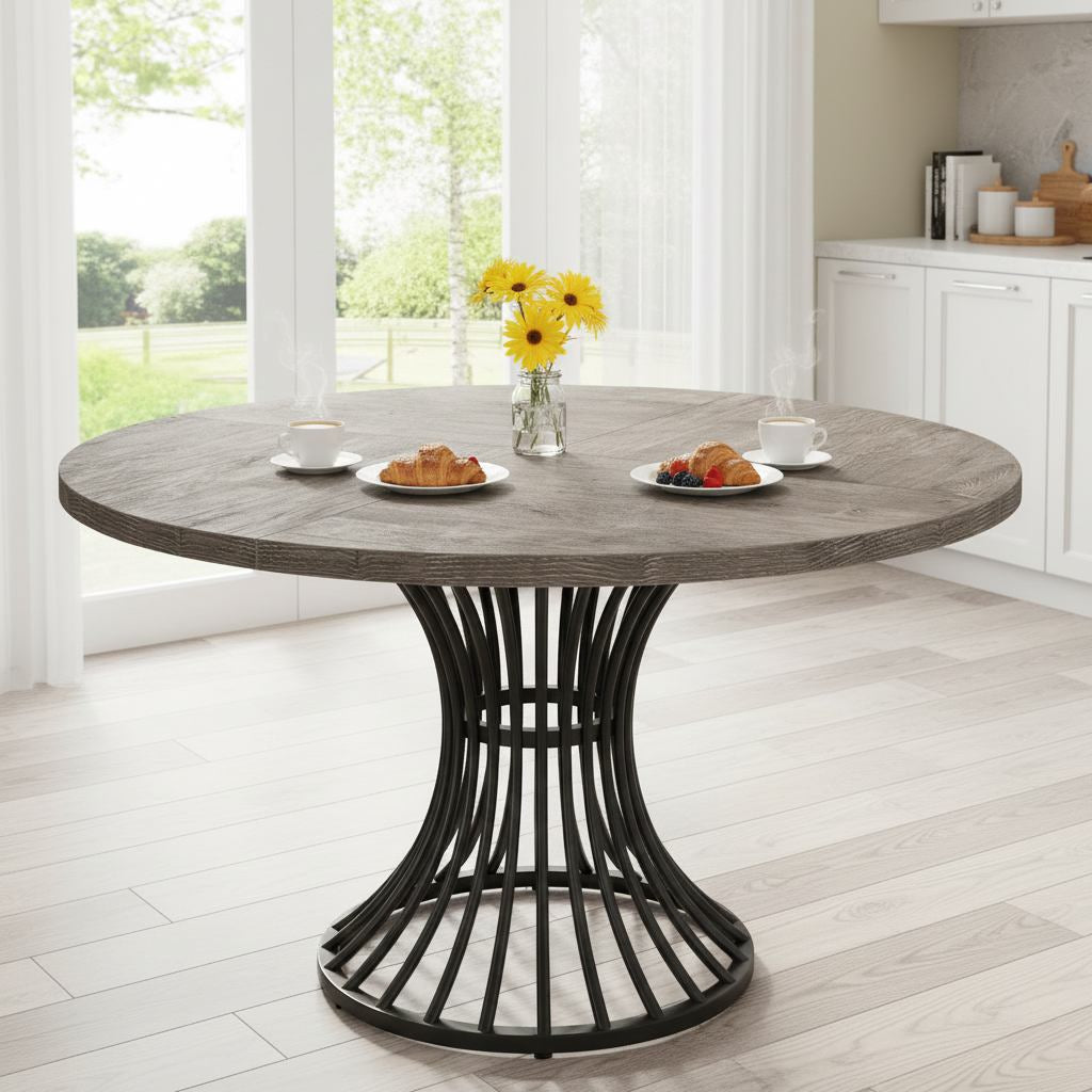 Round 47-inch grey dining table for kitchen and living room, seats 4-6, sculpted black base.