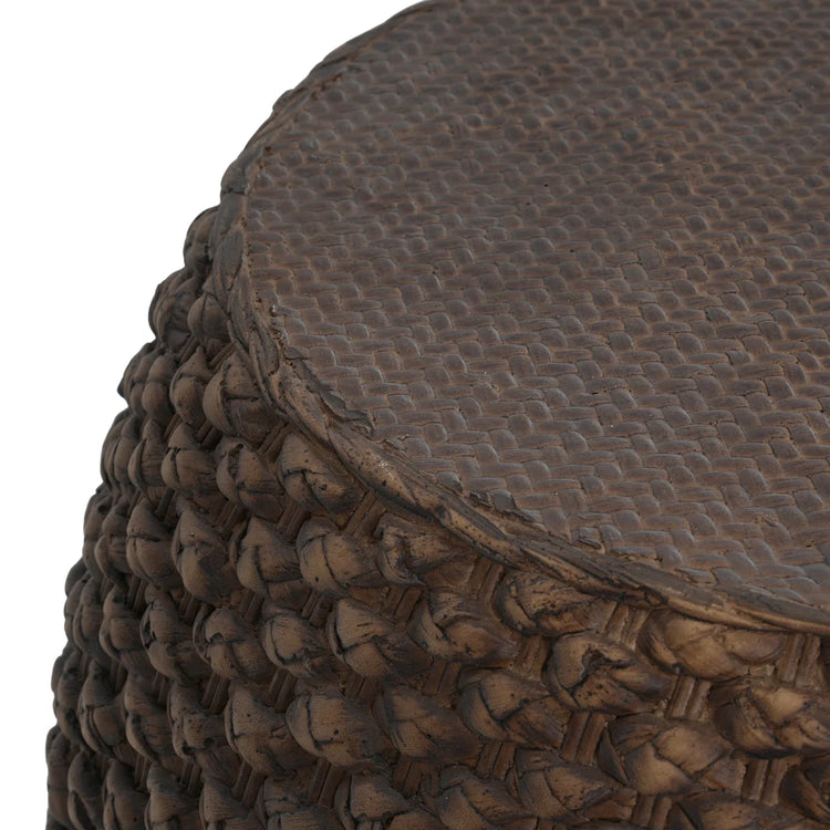 Round faux rattan side table with woven brown texture for indoor and outdoor use.