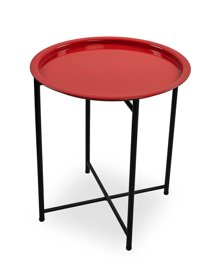Round red tray table with black metal legs on a white background