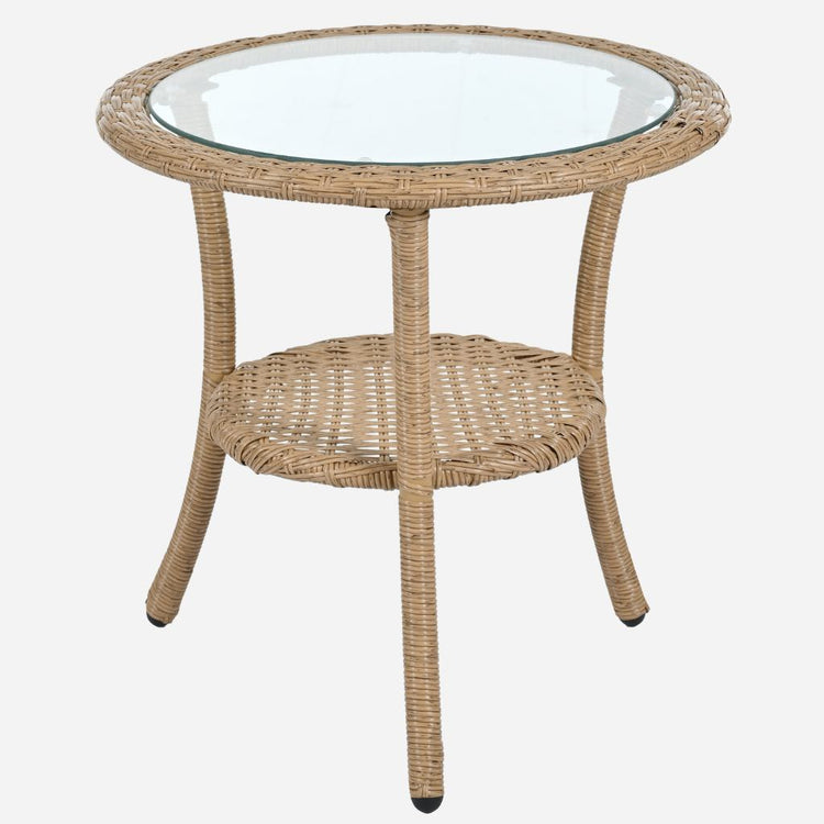 Round wicker side table with glass top on a white background
