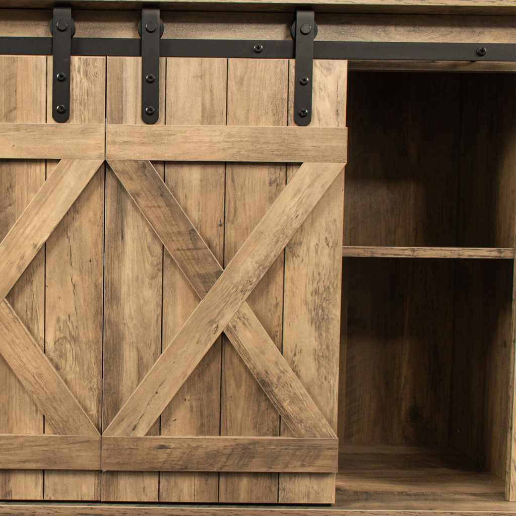 Rustic walnut-finish TV stand with sliding barn door and open storage on the right.