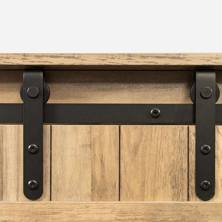 Rustic walnut TV stand with sliding barn door and black metal hardware.