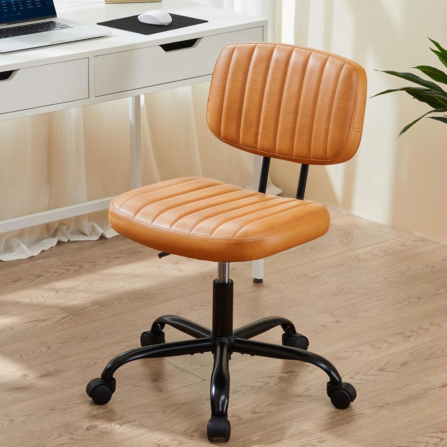 SWEETCRISPY PU Leather Low-Back Task Chair with cushioned, vertically stitched tan seat on a black five-star base.