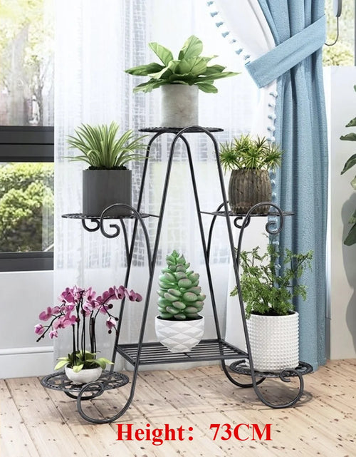 Six-layer black metal plant stand with curved scrolls; six tiers for pots, space-saving garden rack, 73 cm tall.