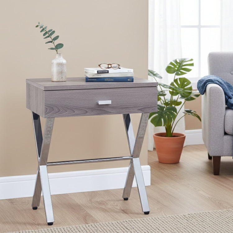 Sleek dark taupe finish accent table with chrome metal legs beside sofa, adds warmth and contemporary polish.
