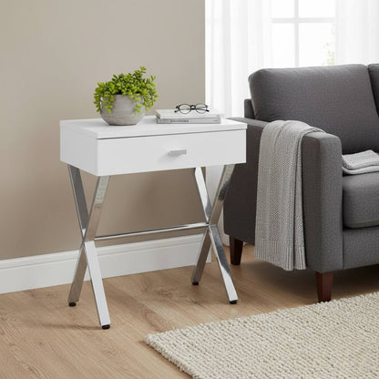 Sleek white Taupe Finish and Chrome Metal Accent Table beside a gray sofa, with a plant, books, and glasses.