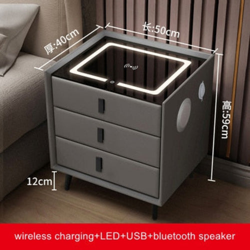 Smart Bedside Table with Qi wireless charging, USB ports, ambient LED night light, three drawers.